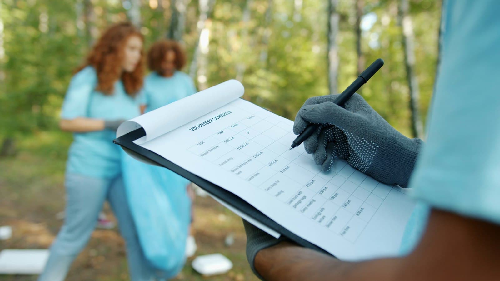 Volunteers checking a clipboard during a clean-up