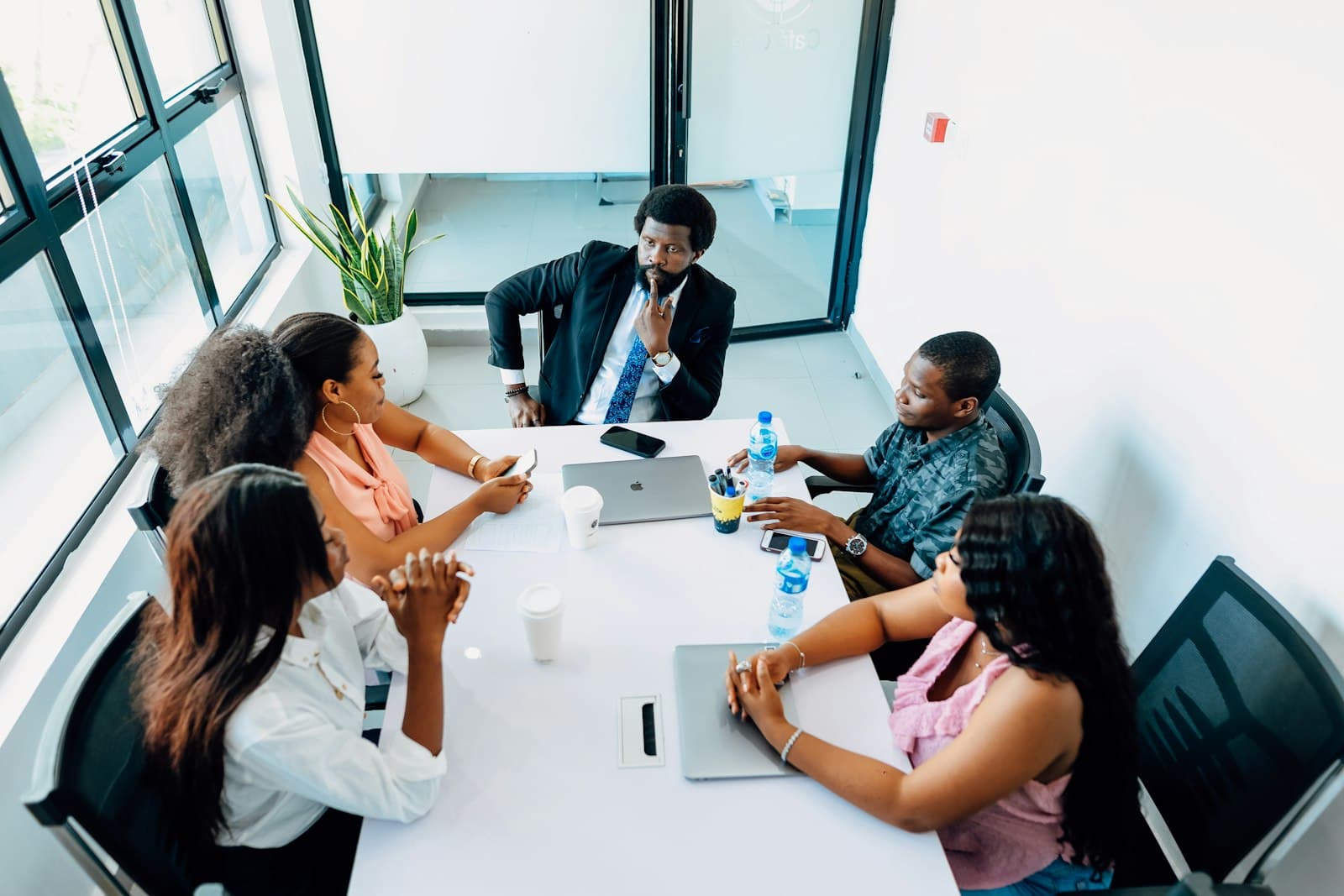 A team meeting around a white table